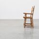 Brutalist armchair with carved rosettes and nailed wooden seat, Spain
