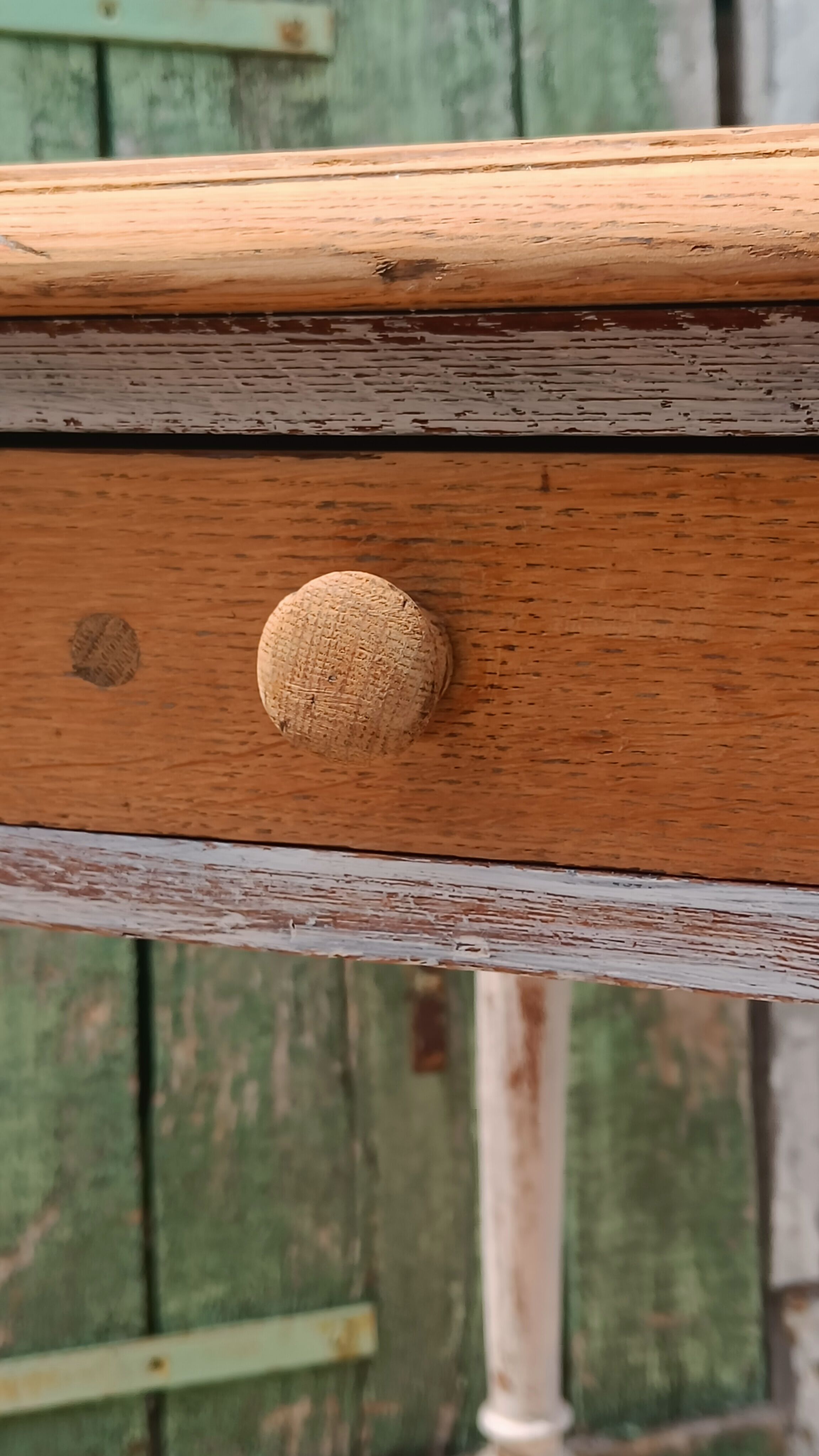 Antique drawer table with a patina.