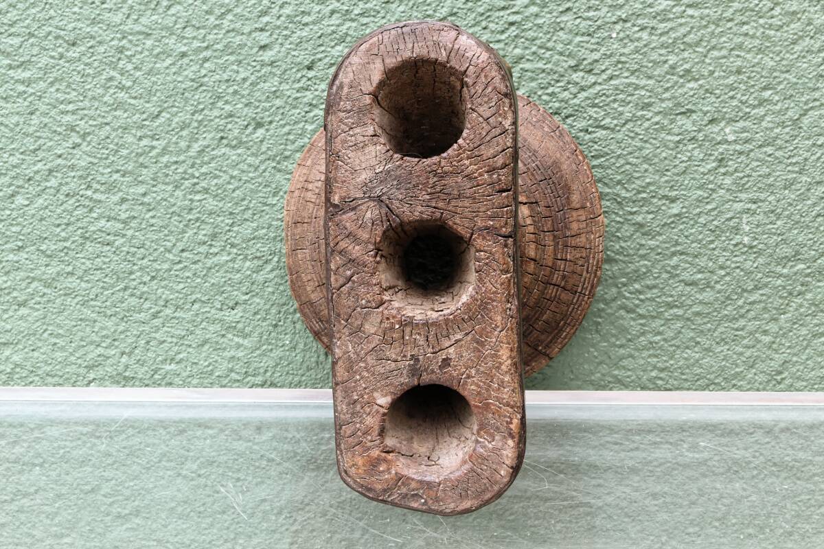 Brutalist candlestick, antique Asian grain sorter in carved wood.