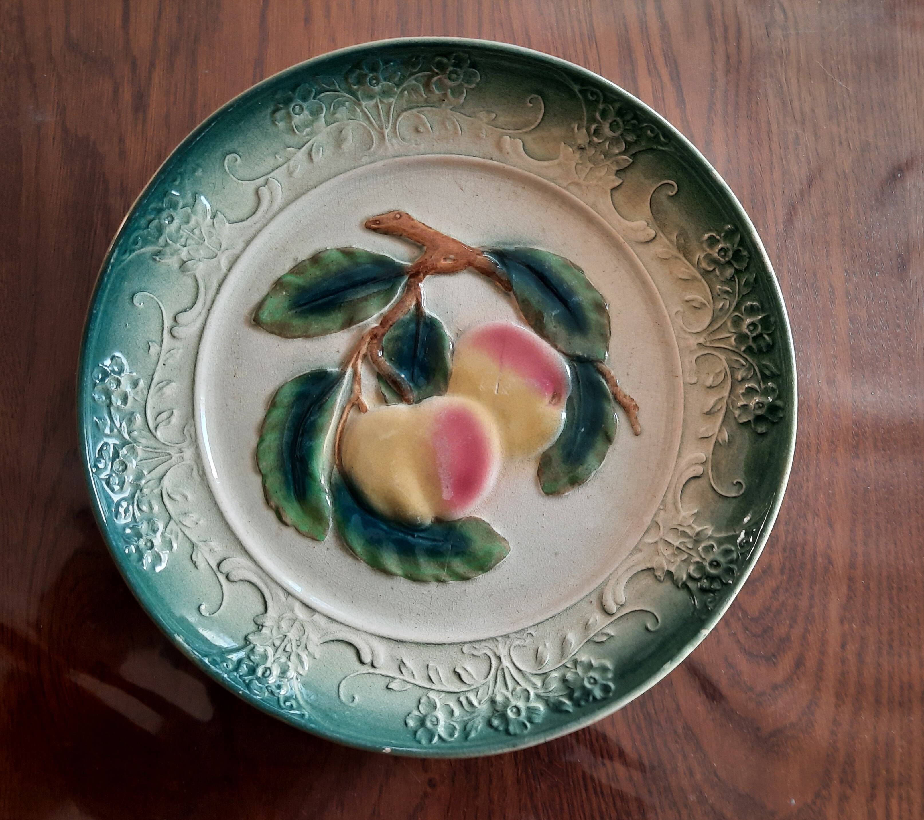 Decorative barbotine plate with apple design. Intended to be hung. Late 19th century.