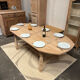 Solid oak farmhouse table with extensions.