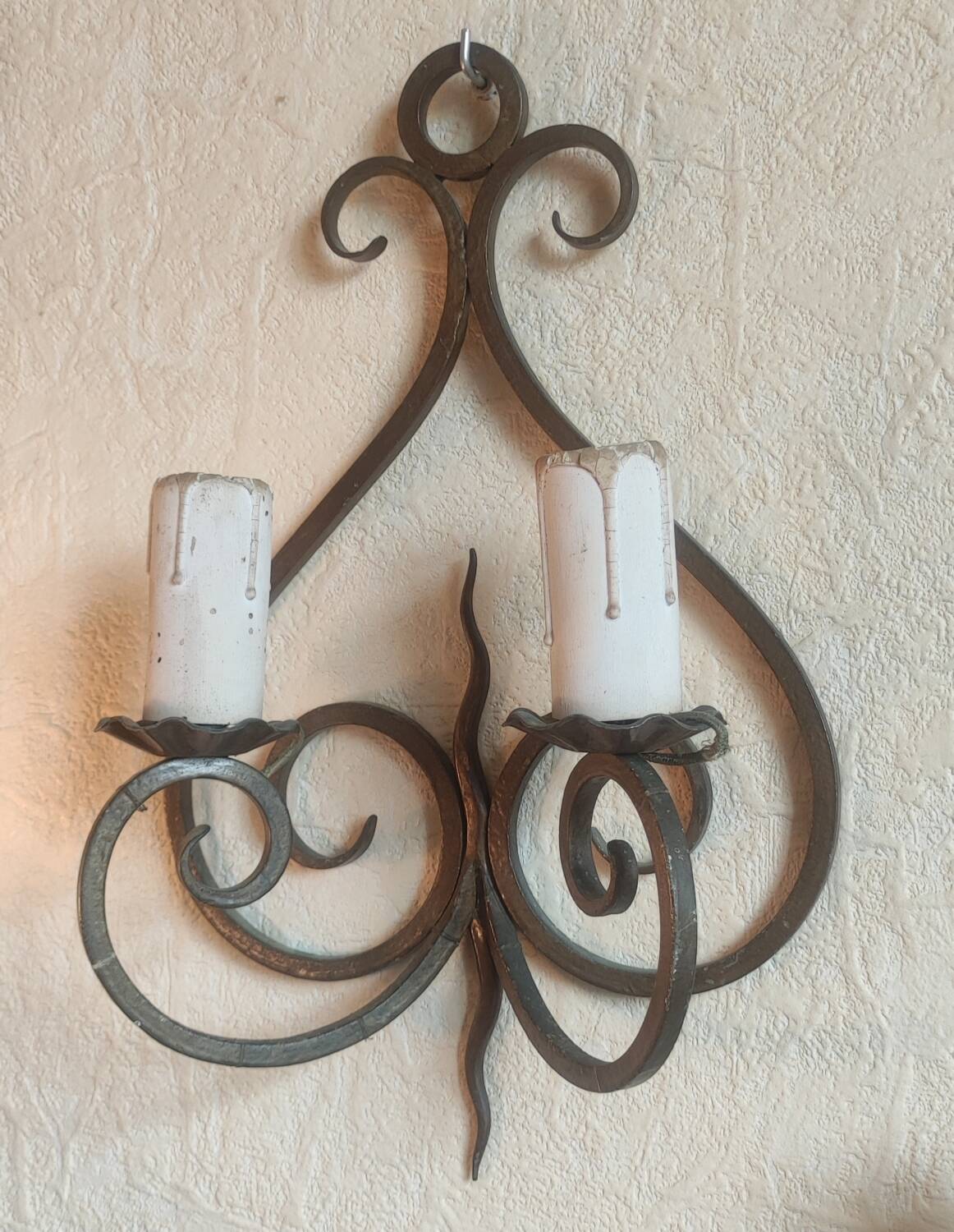 Old pair of wrought iron wall lights