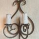Old pair of wrought iron wall lights