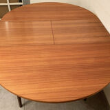 Scandinavian round teak dining table from the 60s extendable