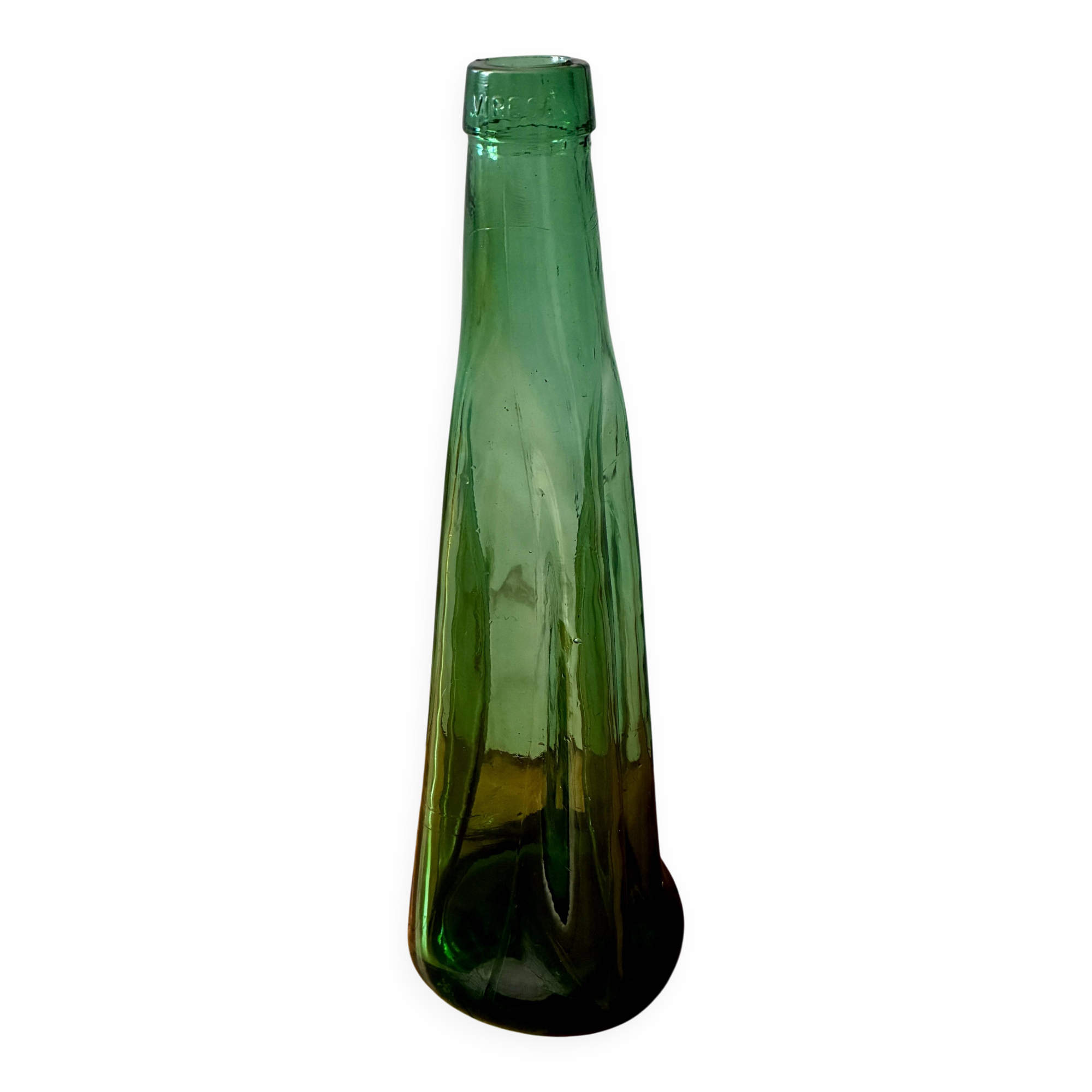 Vintage Viresa bottle in a flattened shape.