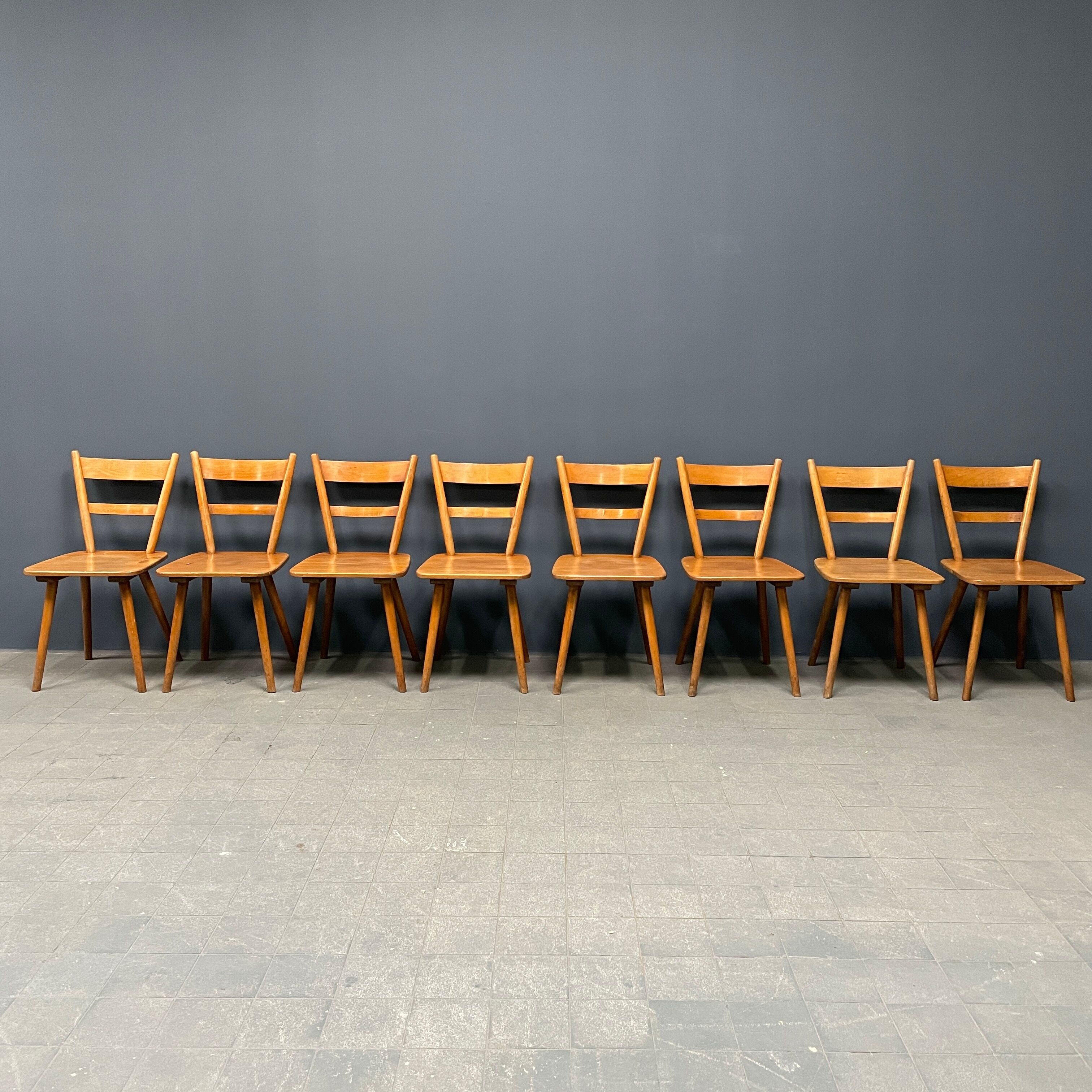 Set of eight german stick chairs from the 1950