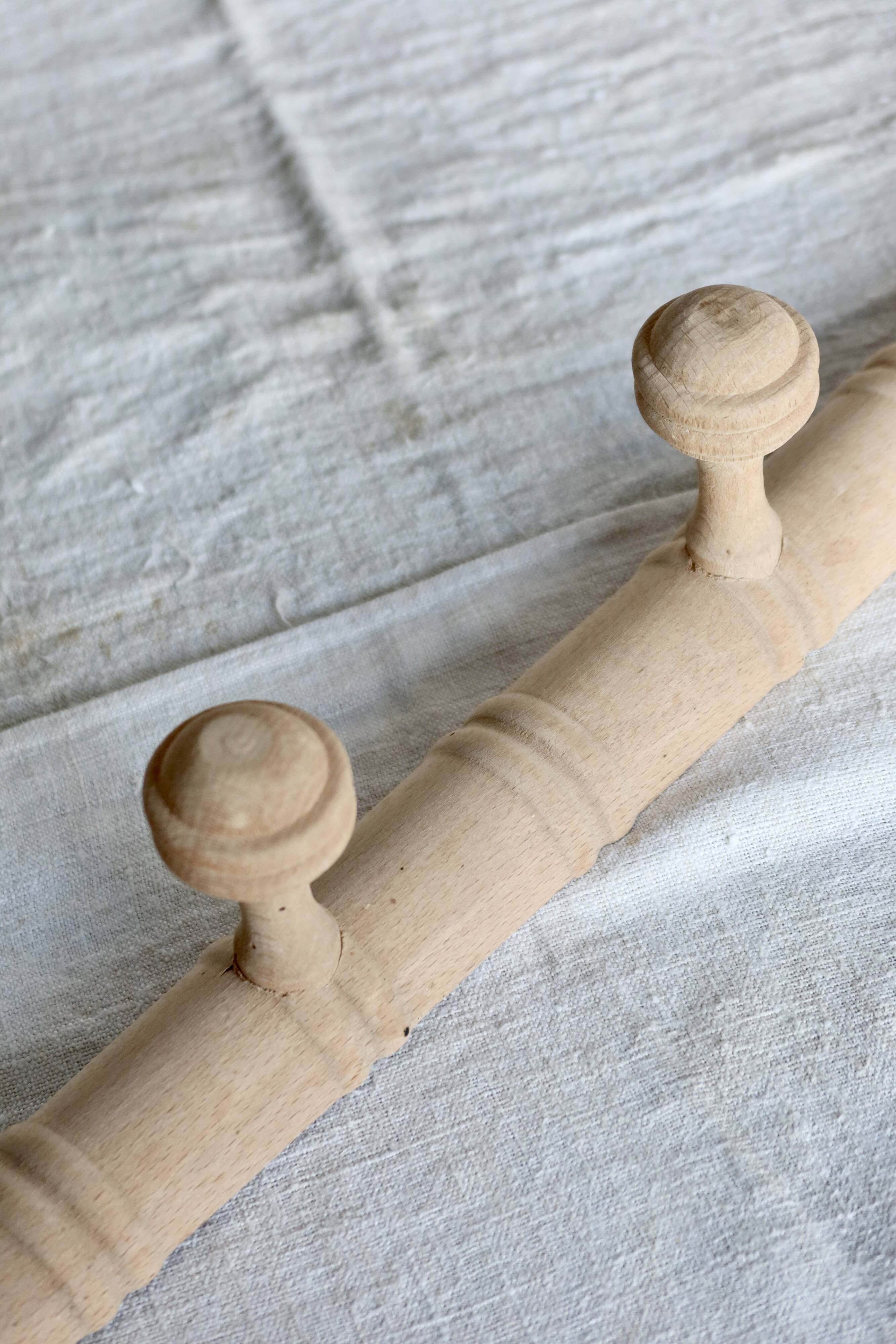 Vintage wall-mounted coat rack in raw wood – Art Deco style