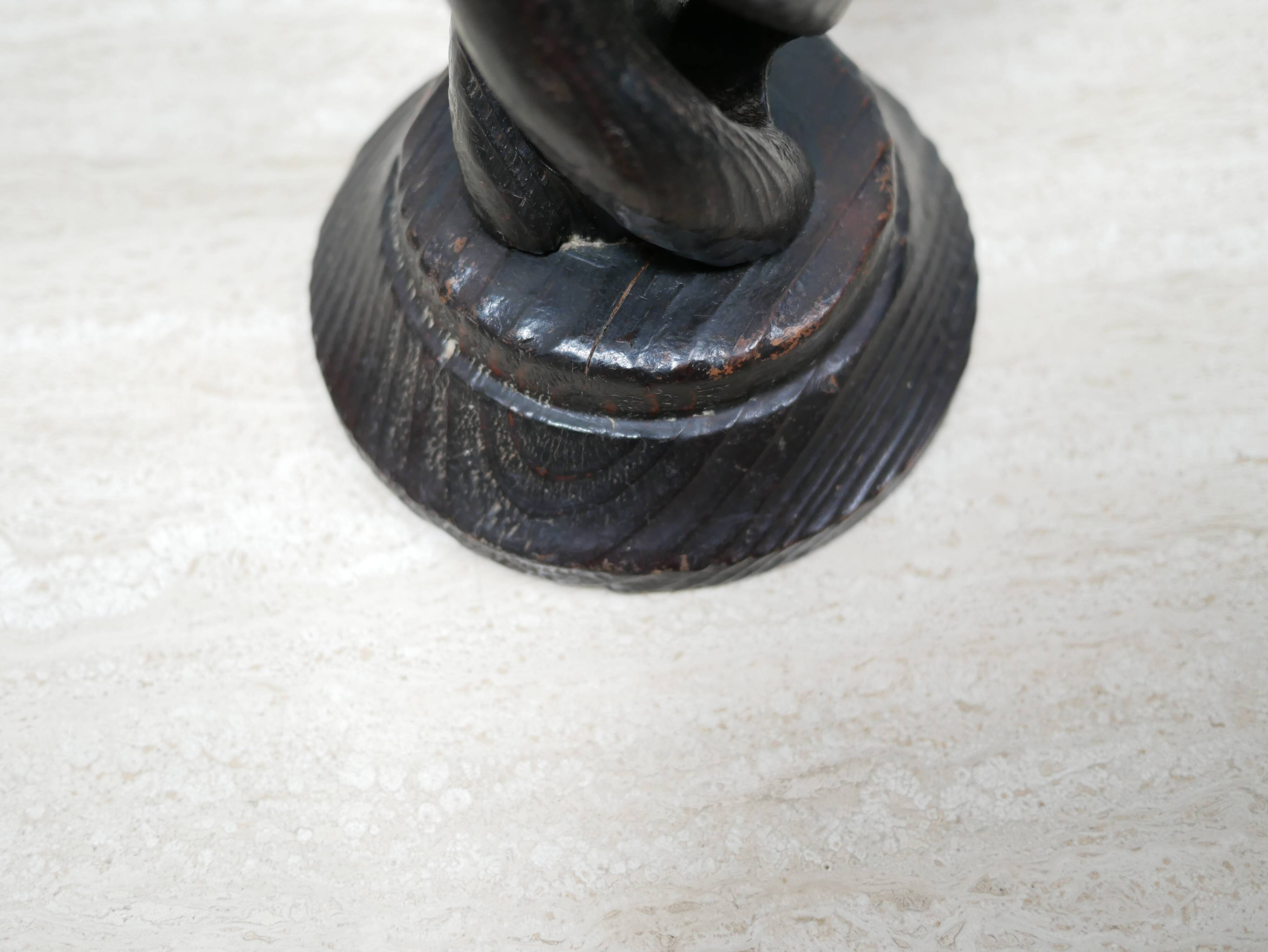 Pair of antique turned wooden candle holders