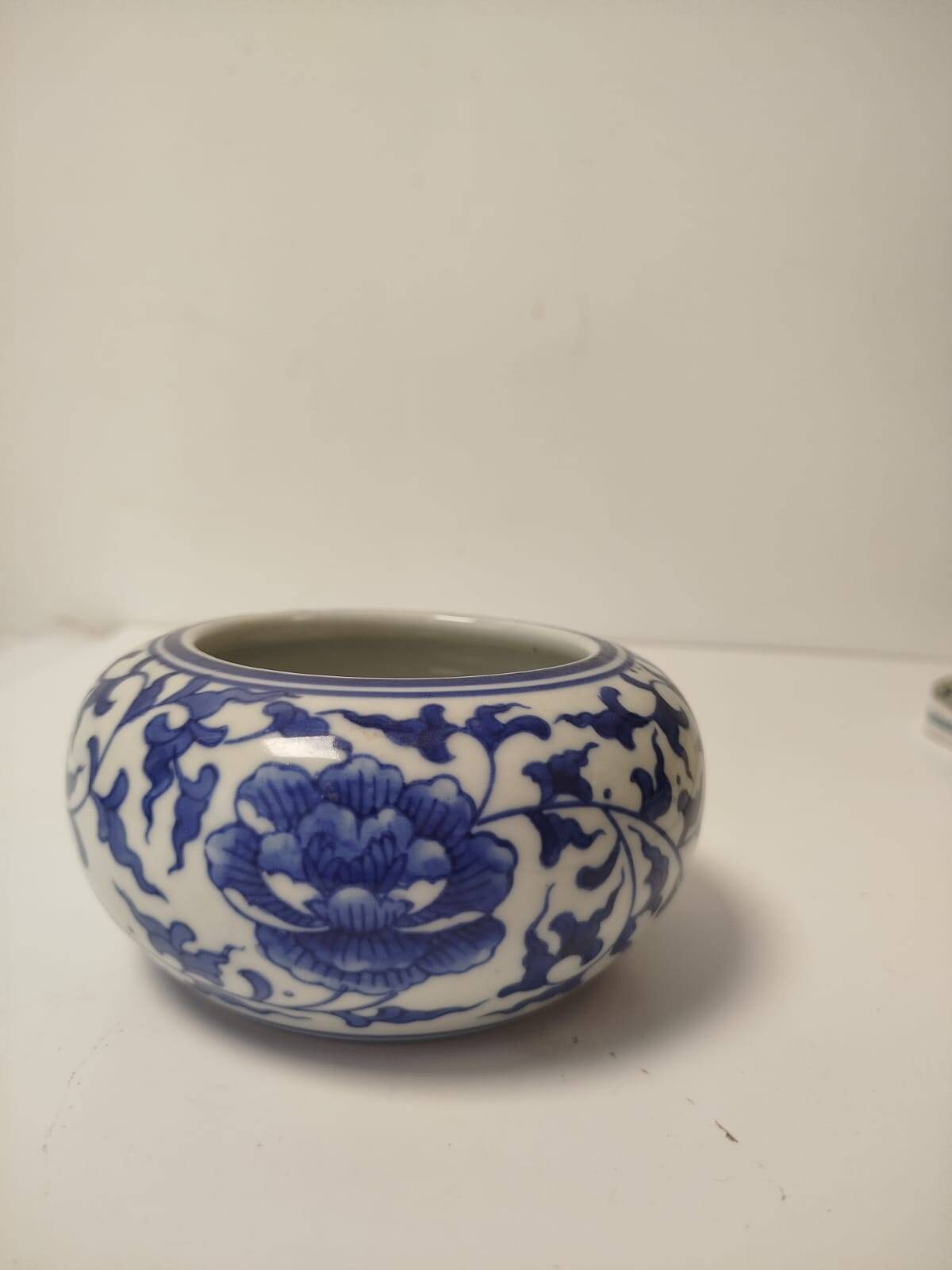 Small round Chinese-style porcelain pot with blue and white decoration