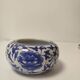Small round Chinese-style porcelain pot with blue and white decoration