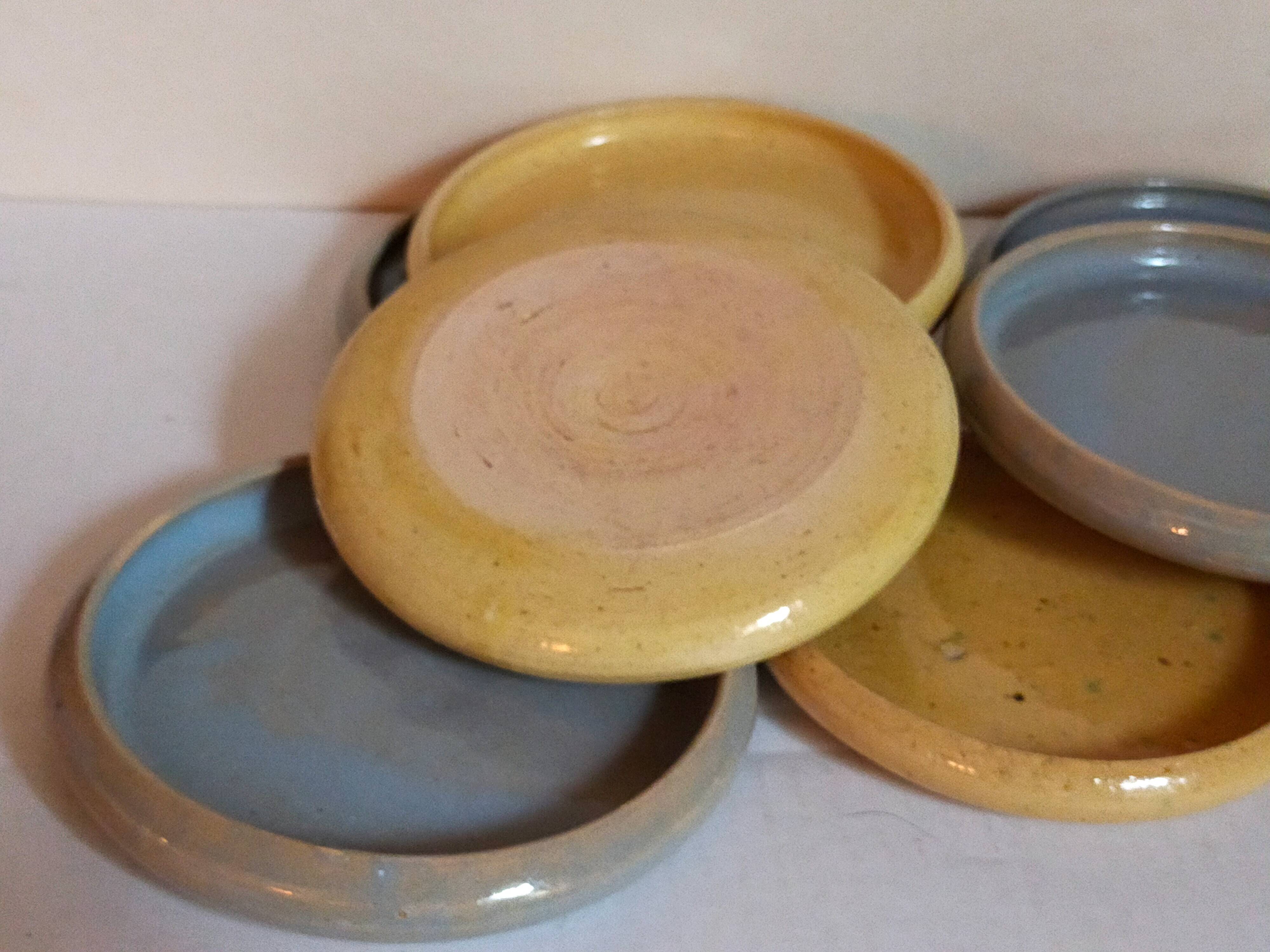 Seven vintage potter's sweet treat plates