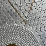 Grey ceramic mosaic top coffee table with dark wood base and brass accents, 1970s