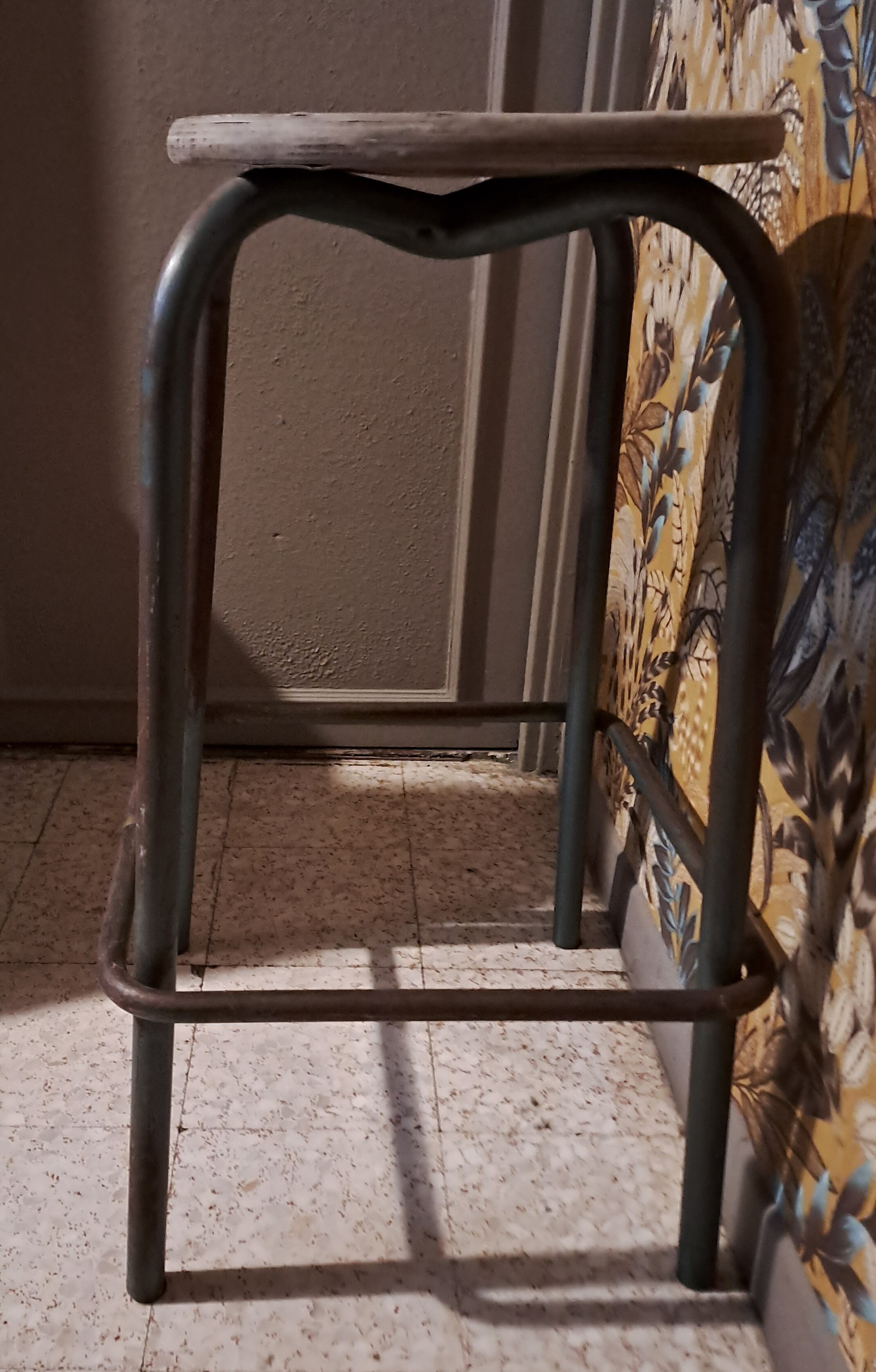 High metal stool and wooden seat Labo style dating from the 1940s industrial style