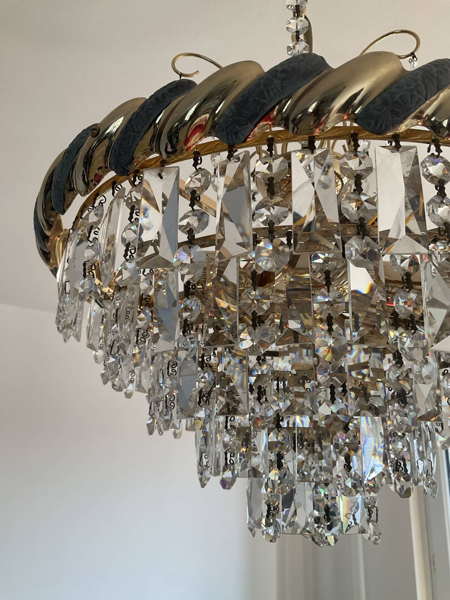 Crystal and brass chandelier with a cascade of pendants.