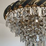 Crystal and brass chandelier with a cascade of pendants.