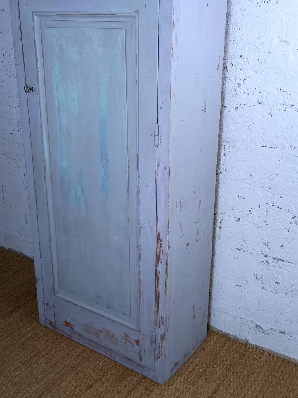 Rustic antique bonnetière in weathered blue-grey wood.