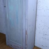 Rustic antique bonnetière in weathered blue-grey wood.