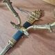 Pair of Empire style wall sconces in gilded bronze and green lacquer.