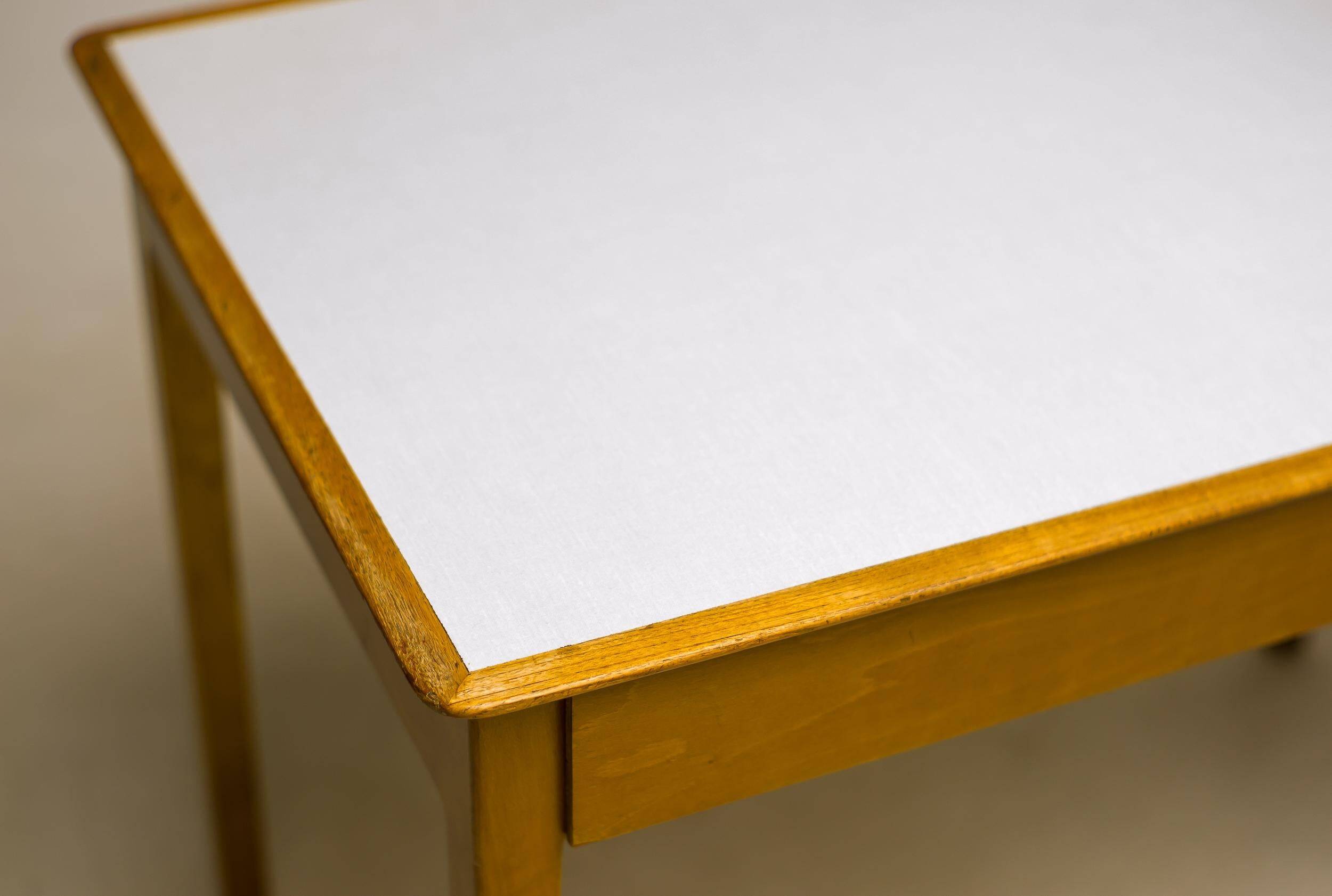 Small maple desk with a laminate top and two drawers, Fritz Hansen, 1950s.