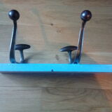 Wall coat holder with two metal pads