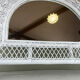 Half-moon wicker mirror