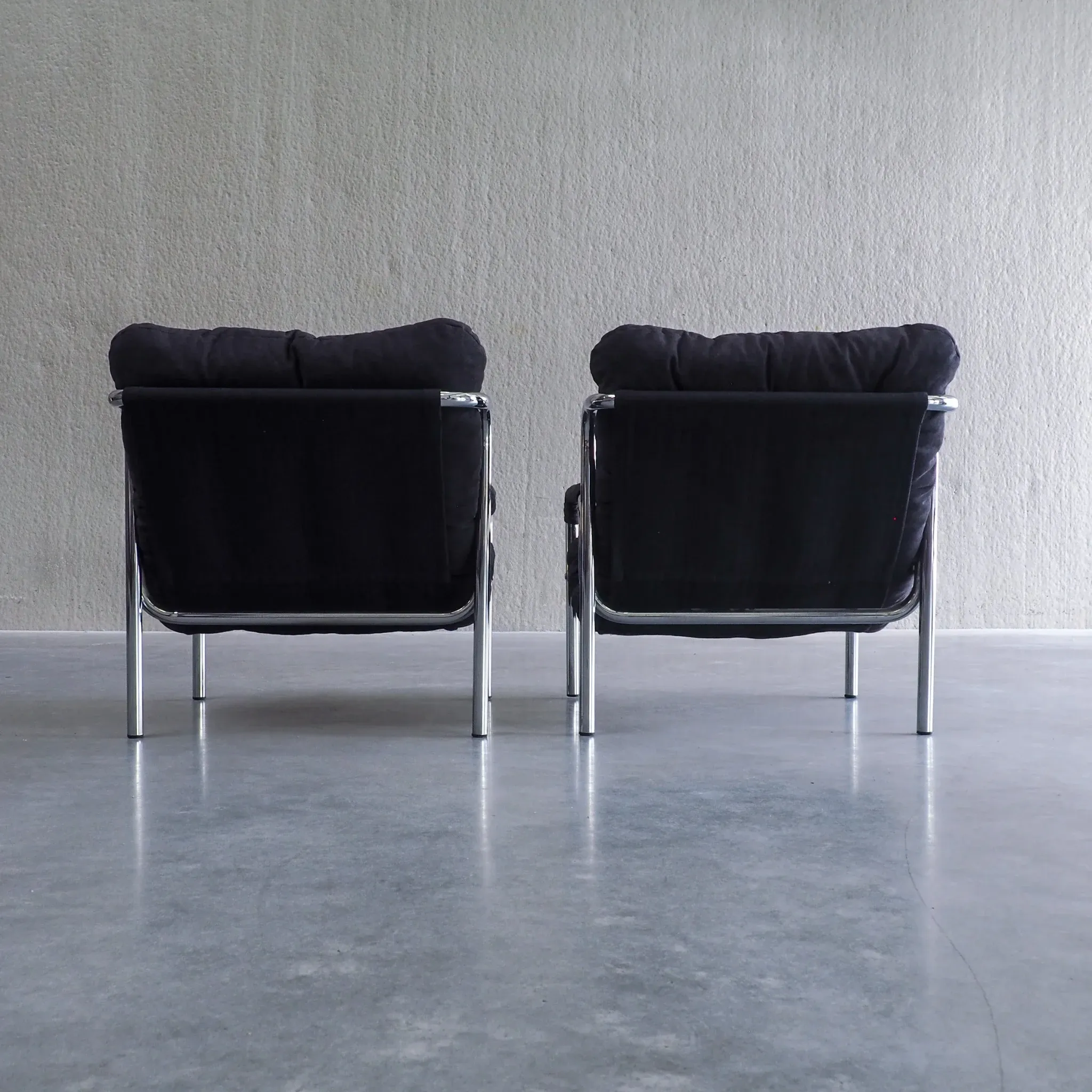 Pair of mid-century modern tubular lounge chairs