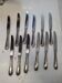 12 silver-plated metal knives from the mid-20th century
