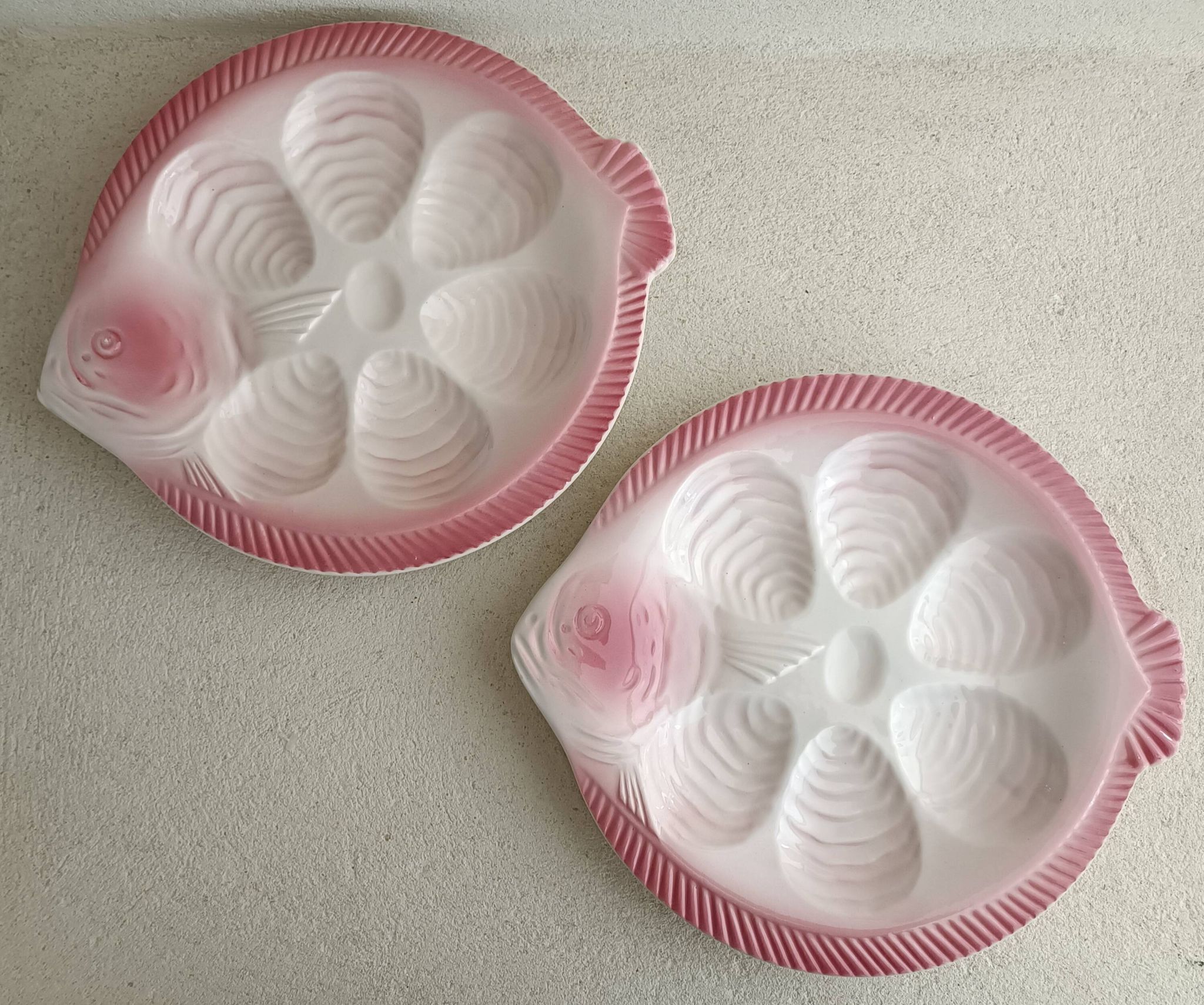 Vintage oyster plates in the shape of a sole.