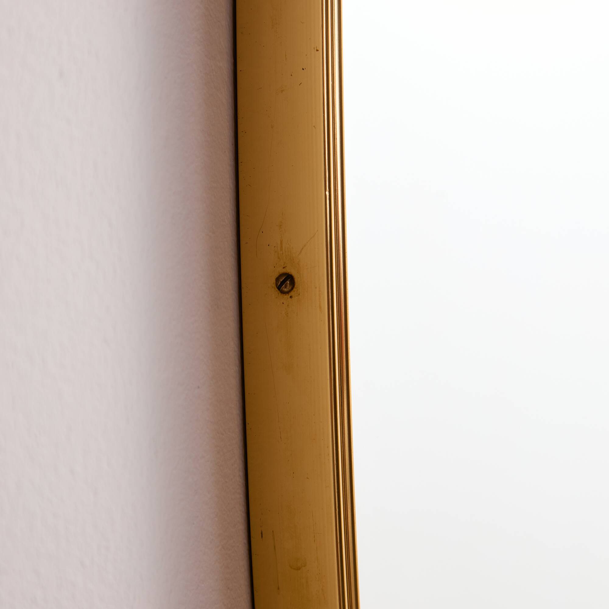 Metal and brass framed mirror