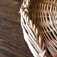 Large round wicker tray with two handles, vintage weaving.