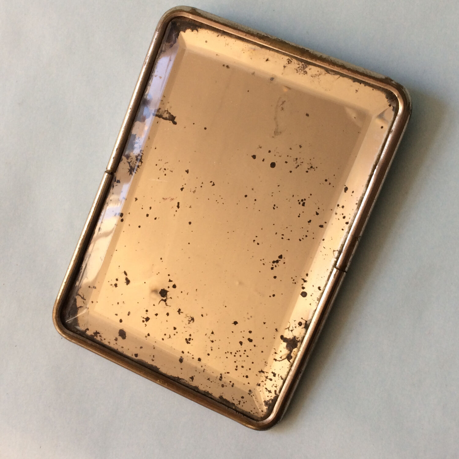 Beveled travel mirror