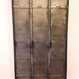 Industrial metal cloakroom with rounded corners.