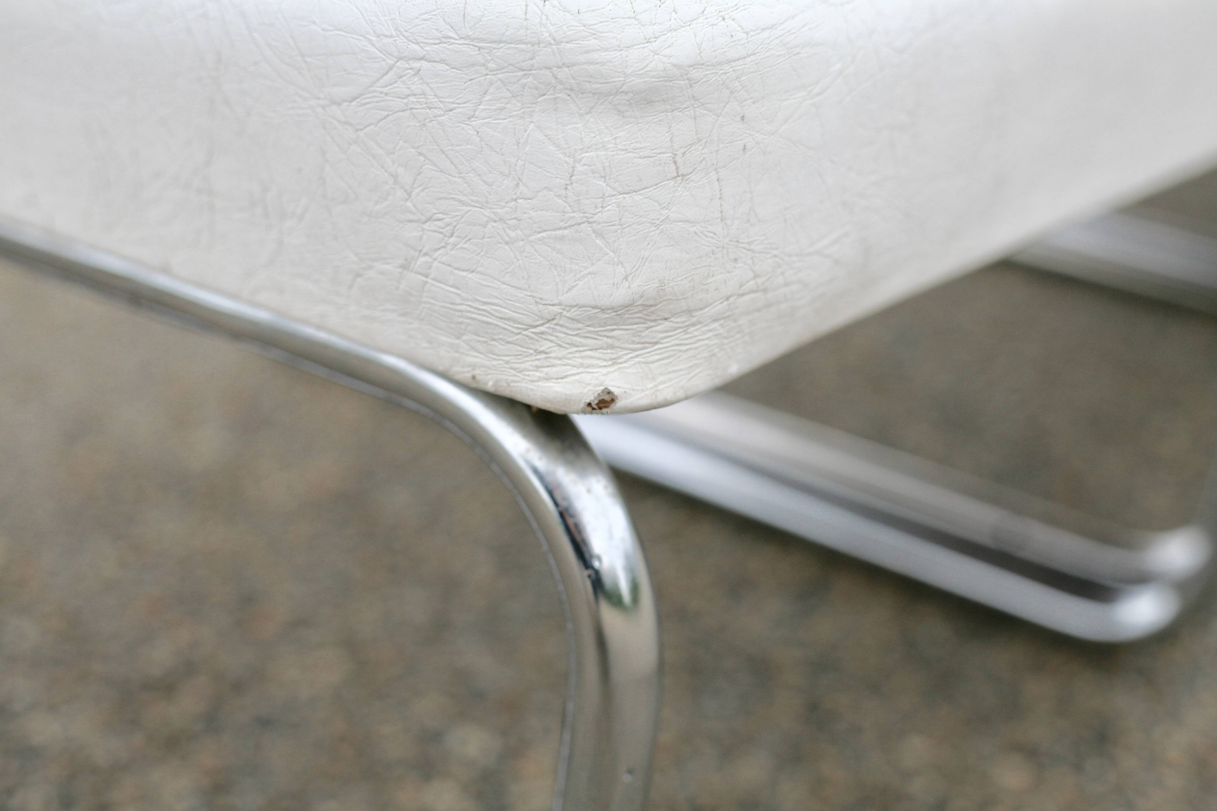 4 armchairs forming a modular sofa. Steel, imitation leather, 70s