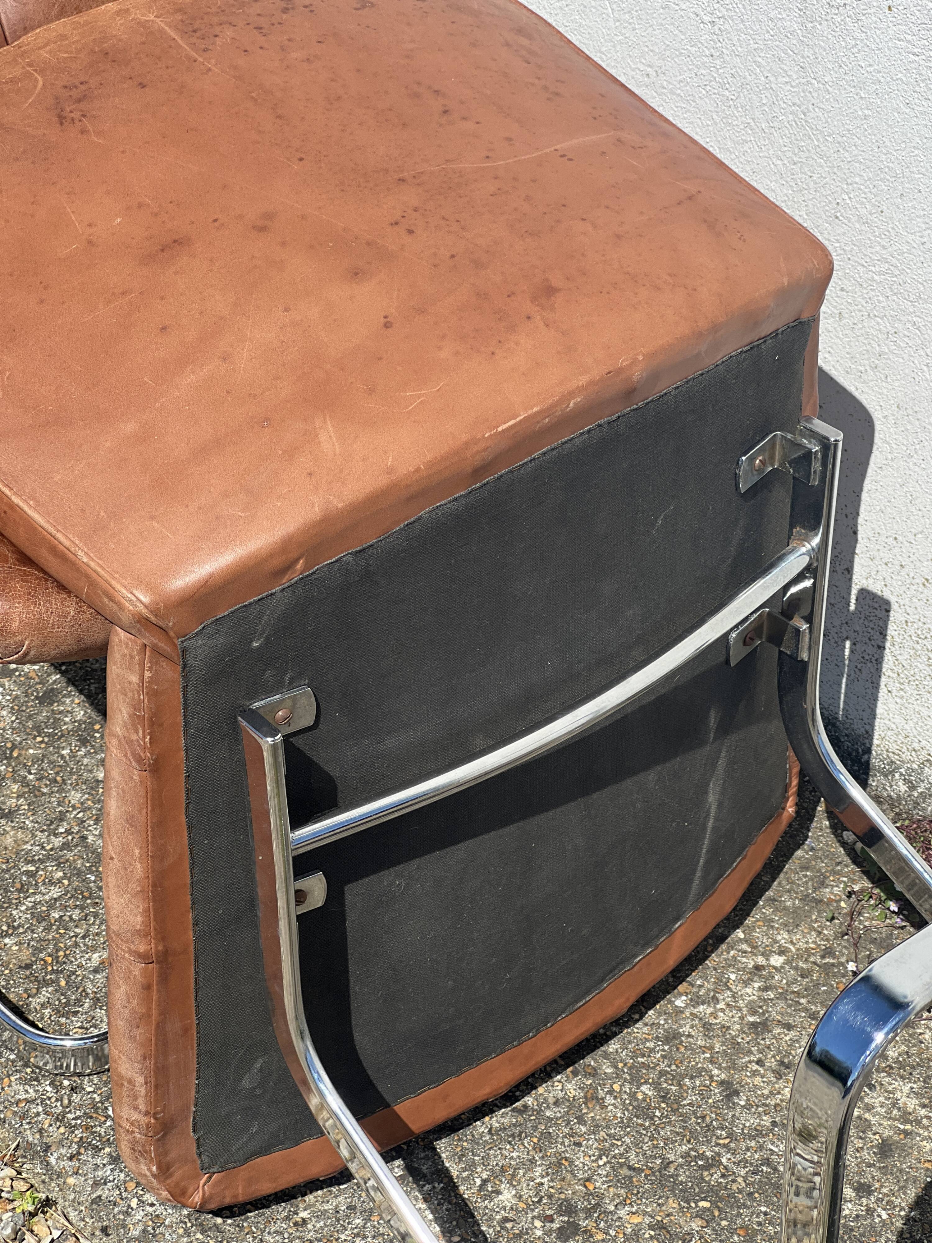 Pair of leather chairs by Robert Haussman