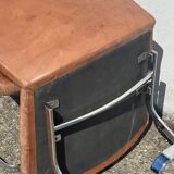 Pair of leather chairs by Robert Haussman