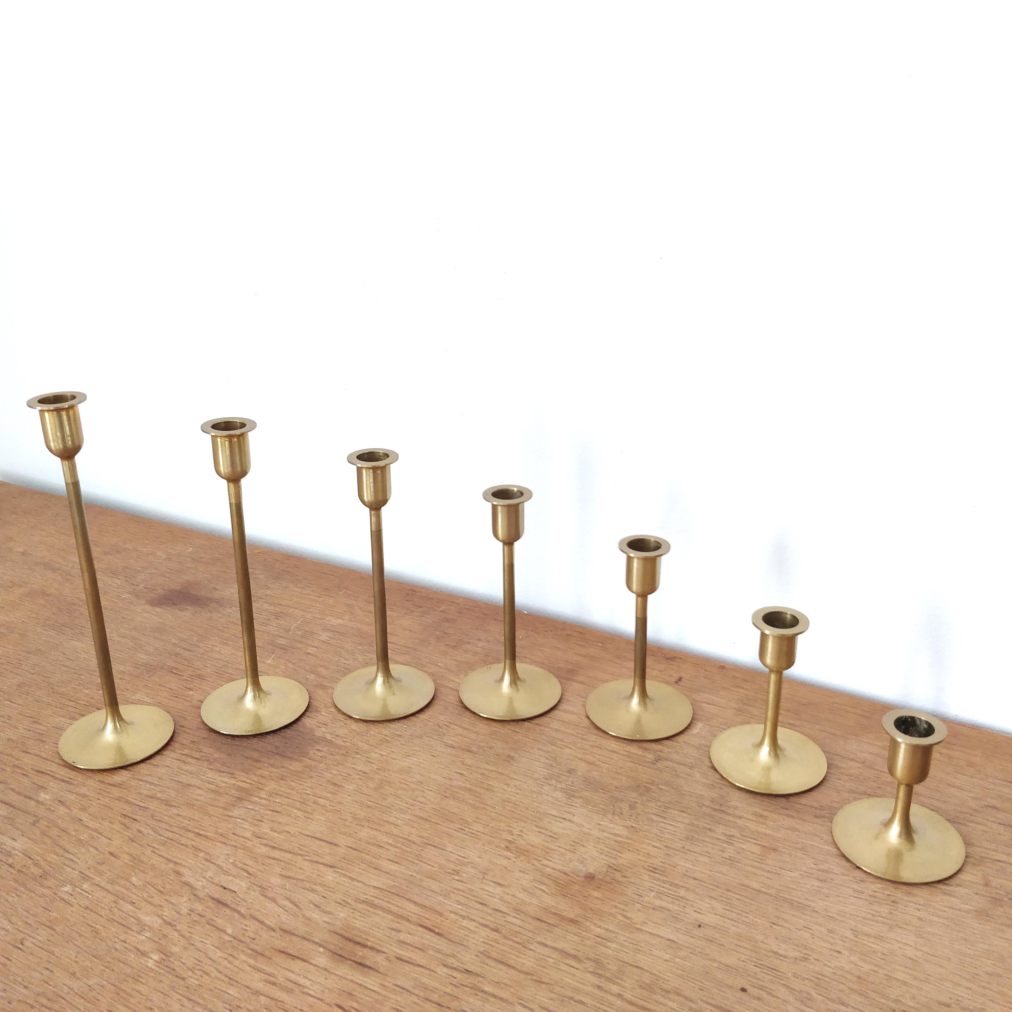 Set of 7 brass candlesticks