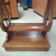 Vintage end table with lyre legs and two drawers.