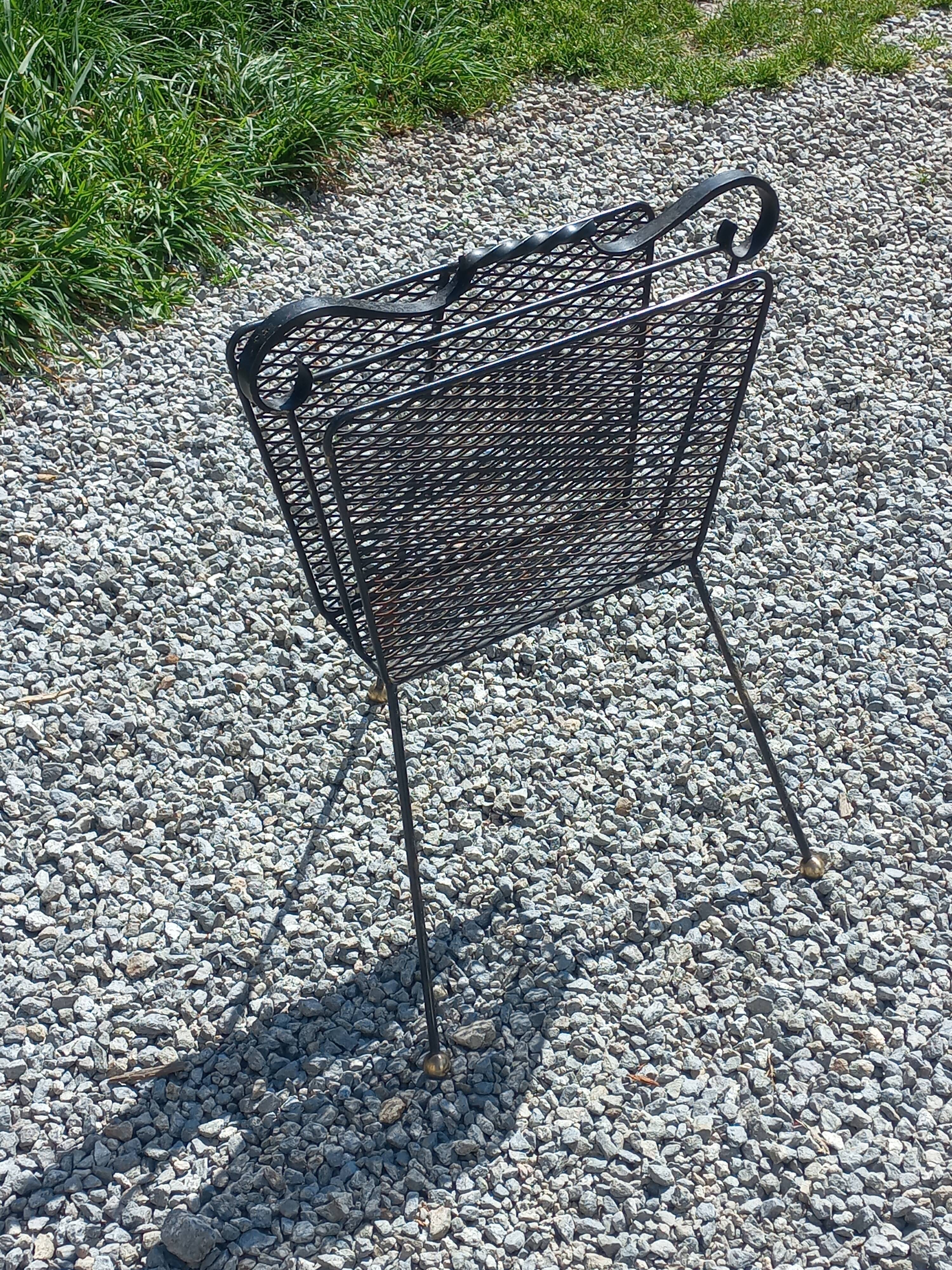Perforated metal magazine rack from the 1960s.