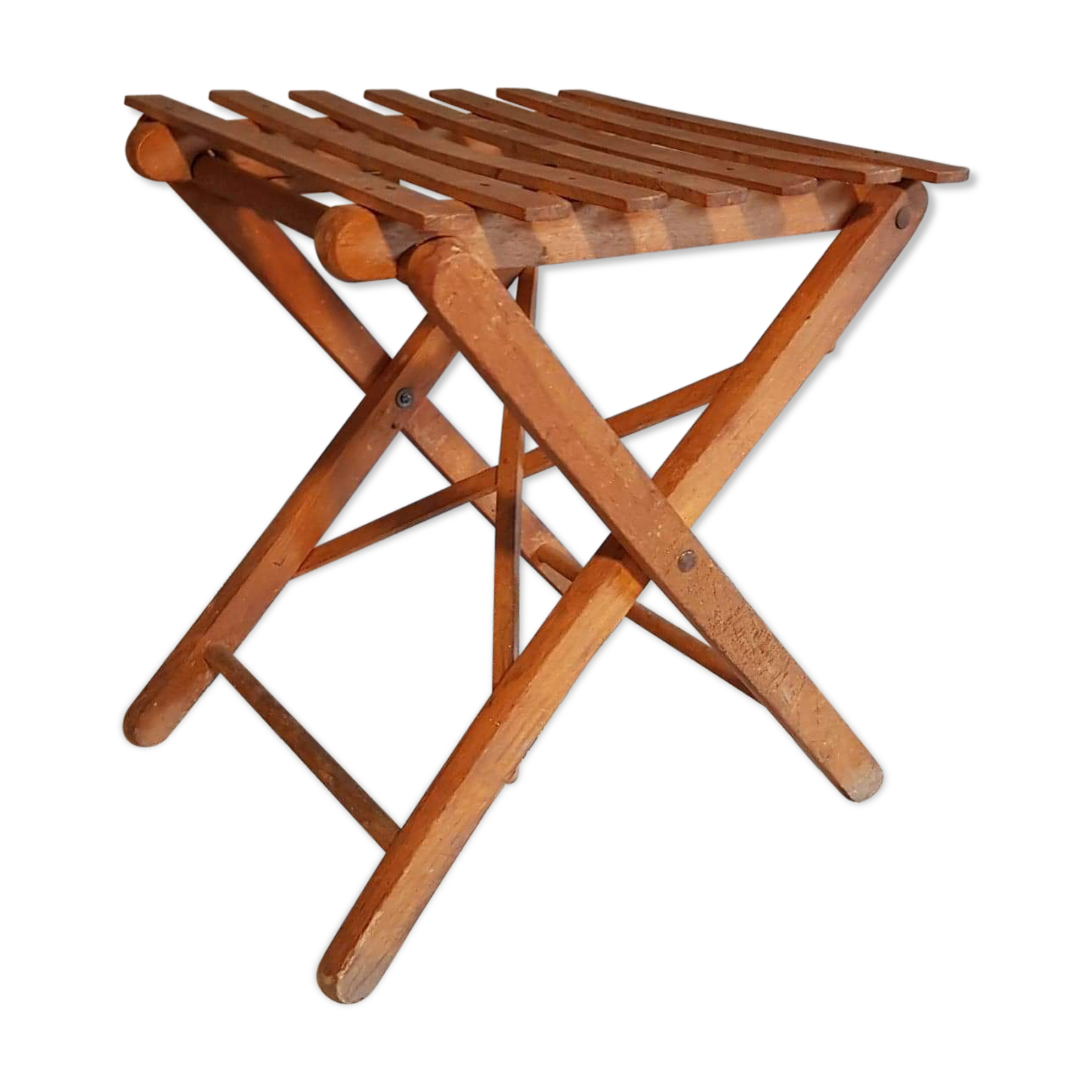 Old foldable stool in tinted wood