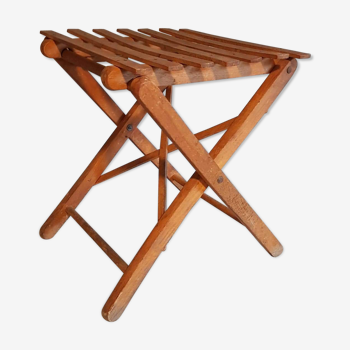 Old foldable stool in tinted wood