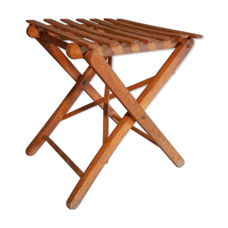 Old foldable stool in tinted wood