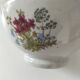 Large light grey speckled earthenware bowl with floral decoration – 1960s–1970s