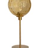 Table lamp with an antique vintage gold globe, mounted on a gold base