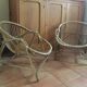 A pair of rattan armchairs