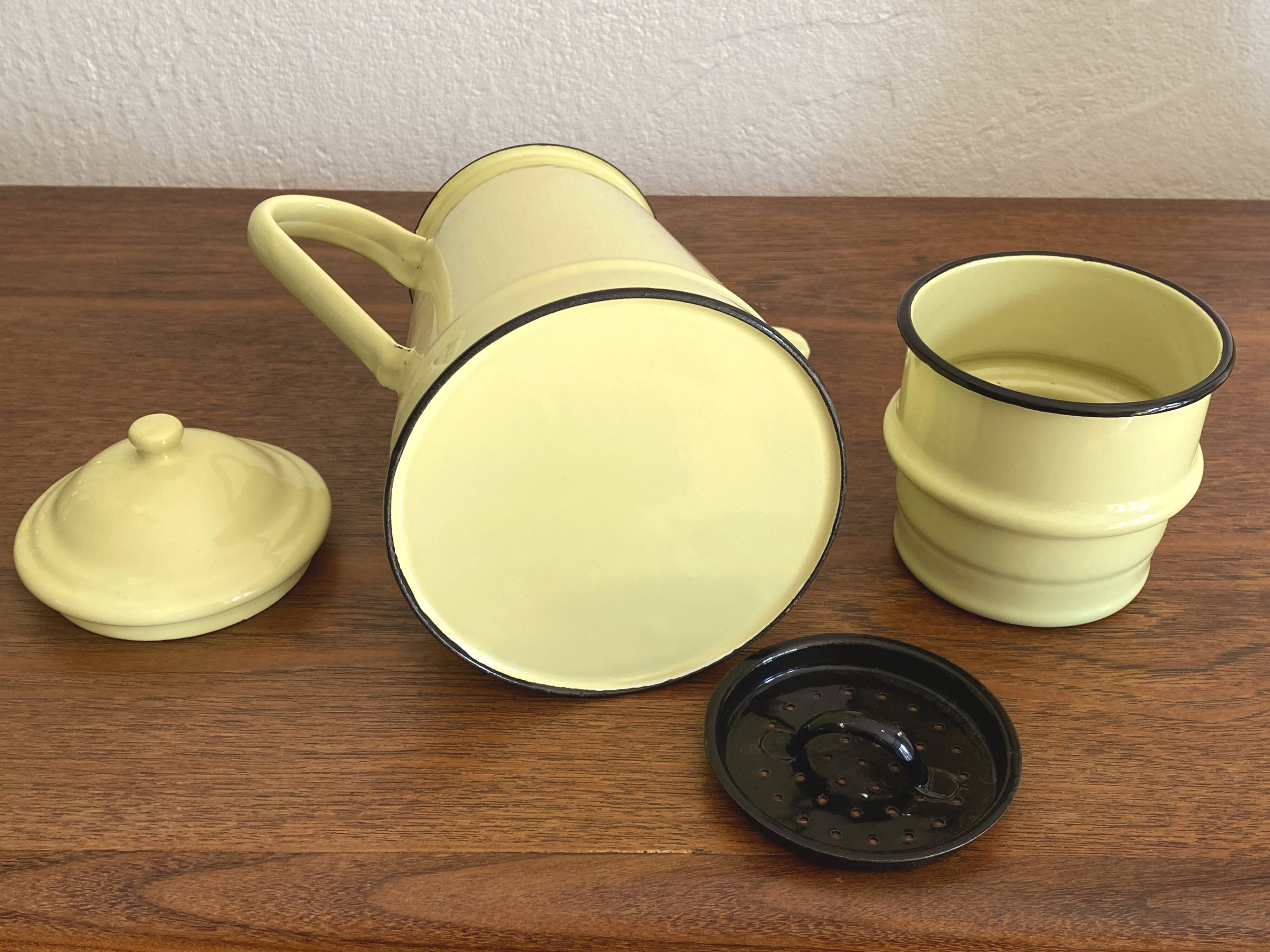 Large vintage coffee pot in pale yellow enamel.