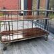 Industrial metal and wood serving trolley on wheels