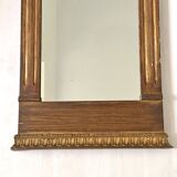 Small golden mirror in Louis XVI style.