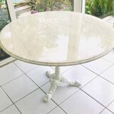 Round marble table with central cast iron leg
