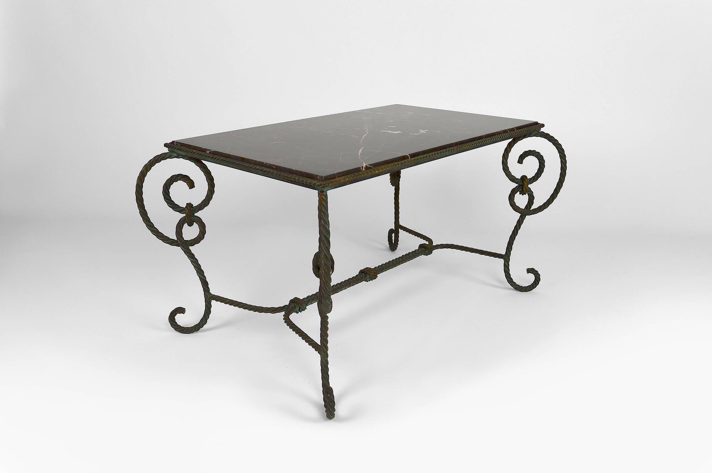 Coffee table in patinated wrought iron and black marble, circa 1940