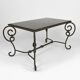 Coffee table in patinated wrought iron and black marble, circa 1940